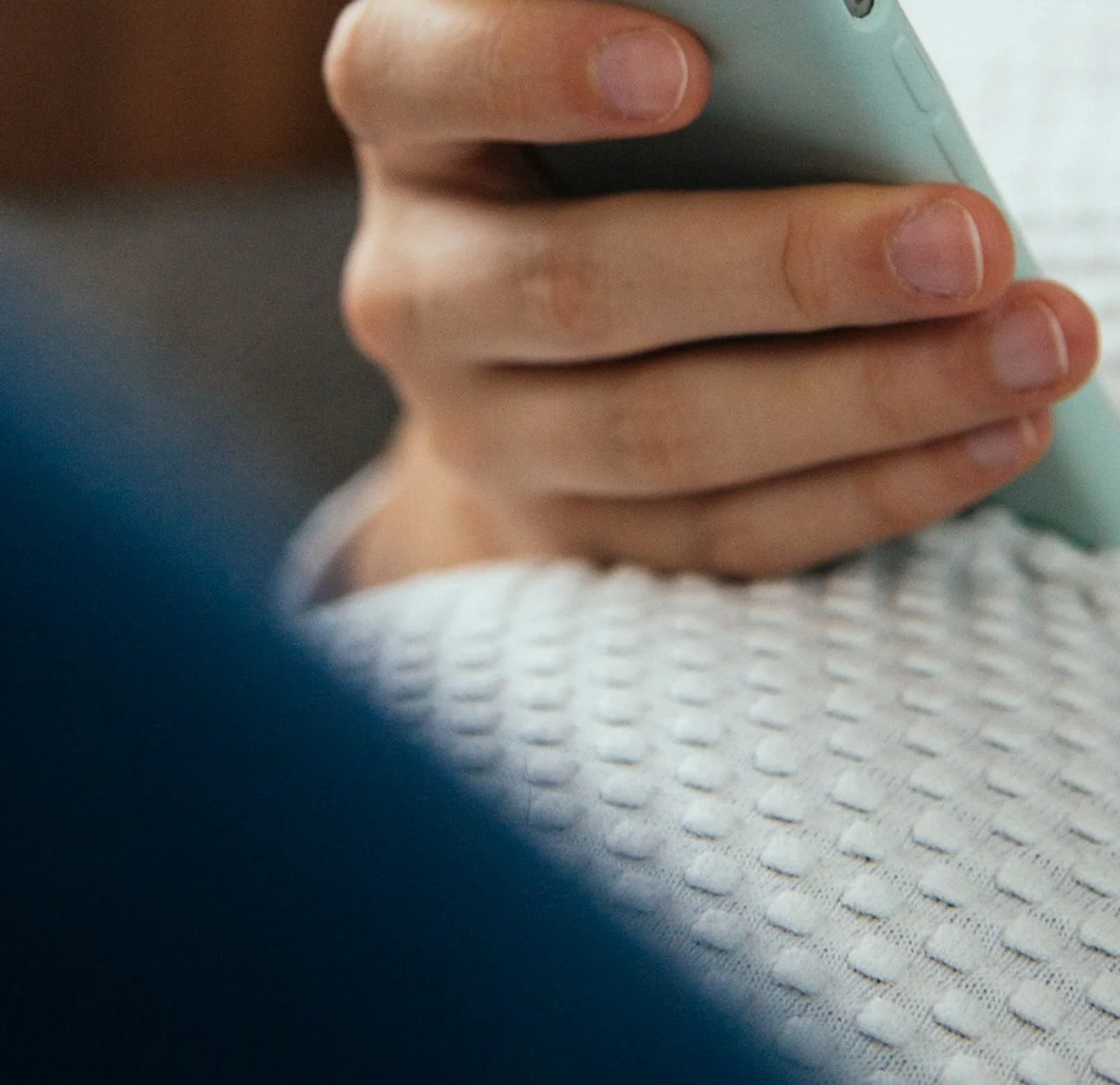 A buyer reviewing shortlisted options and follow-up notes on a phone