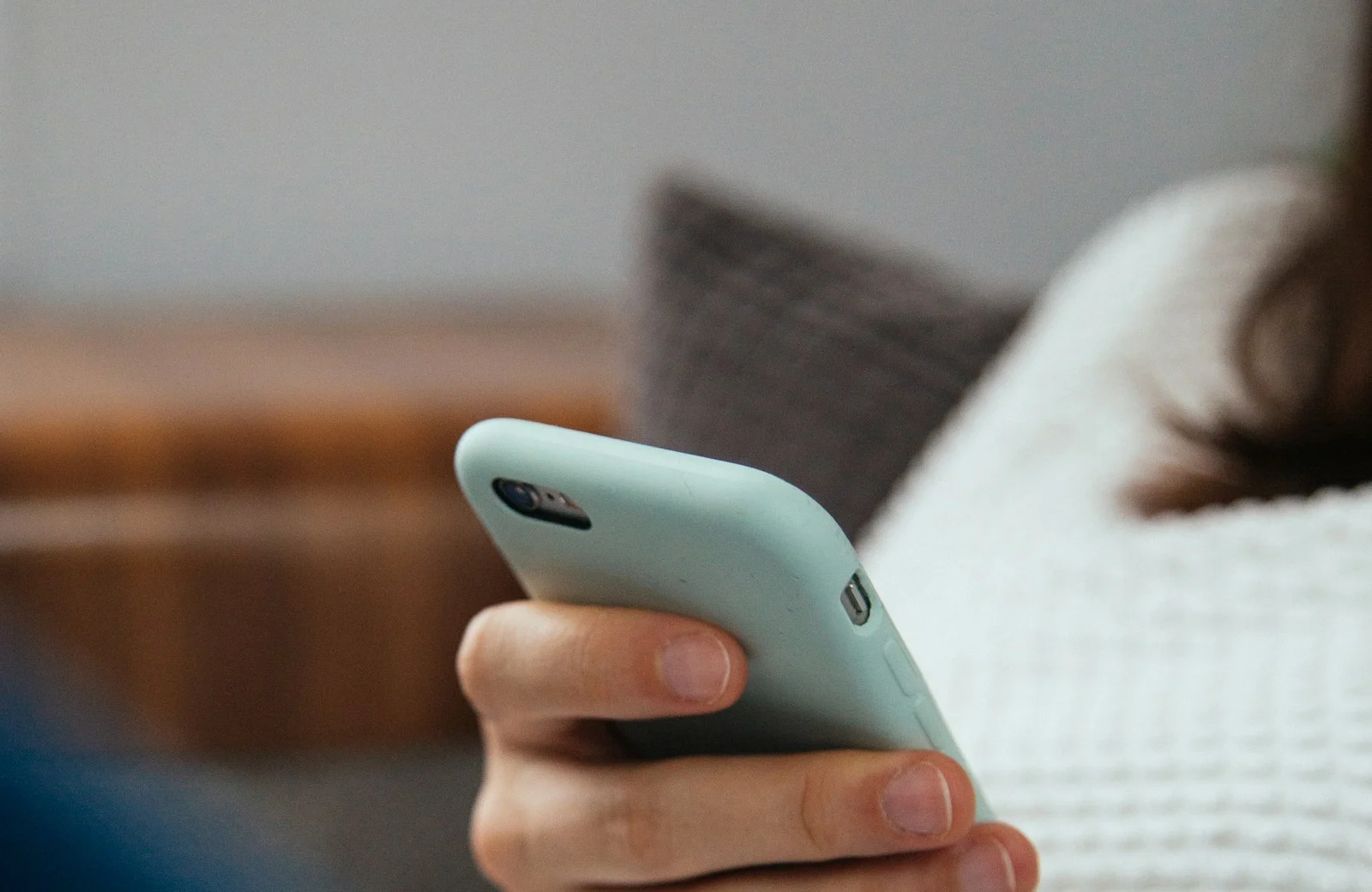 A buyer checking product options on a mobile phone