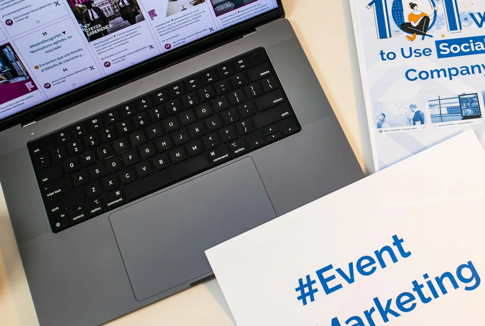 Laptop, notes, and buyer planning materials on a desk