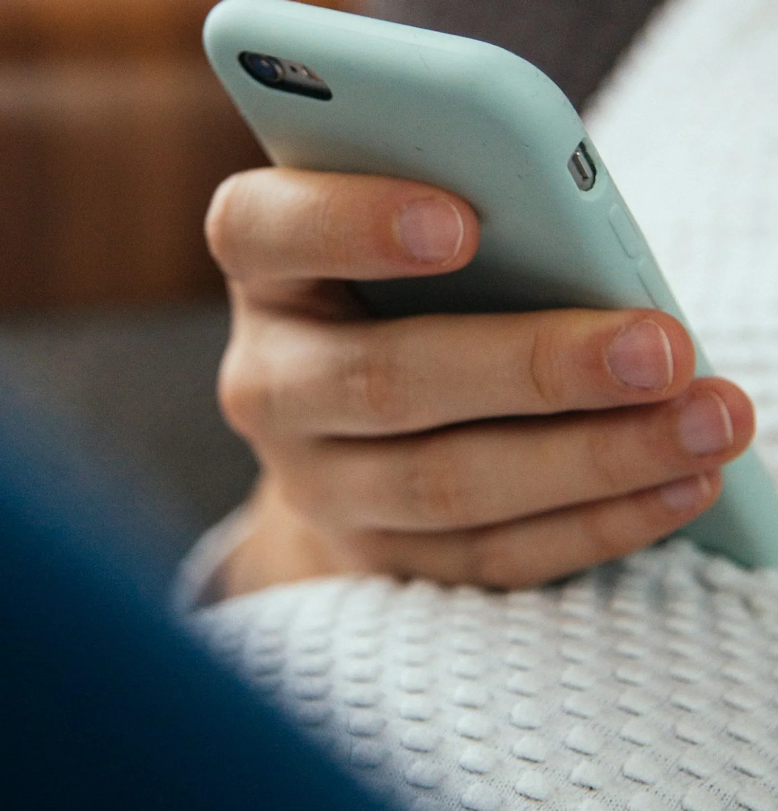 A buyer comparing product options on a mobile phone